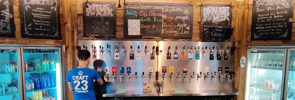 Craft 23 tap wall offering 40 draft beers in Bangkok Thailand
