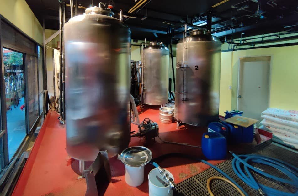 Tanks to hold and allow the beer to age before being pipes to the kegs at the Londoner Brew Pub, Bangkok Thailand