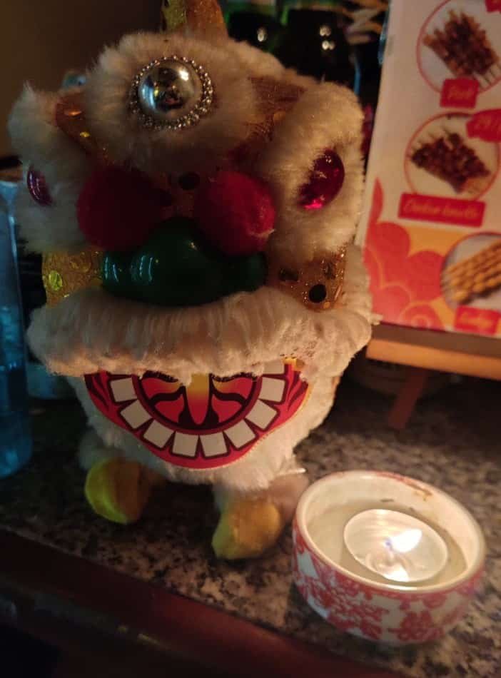 Dragon and candle at Pijiu craft beer bar in Bangkok Chinatown, Thailand.