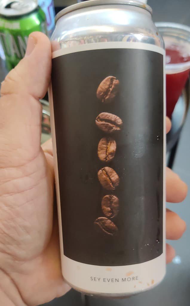 Dry coffee stout - Sey Even More by Evil twin brewing.
Hand holding a tall boy can of beer used for the Bangkok Beer Guide