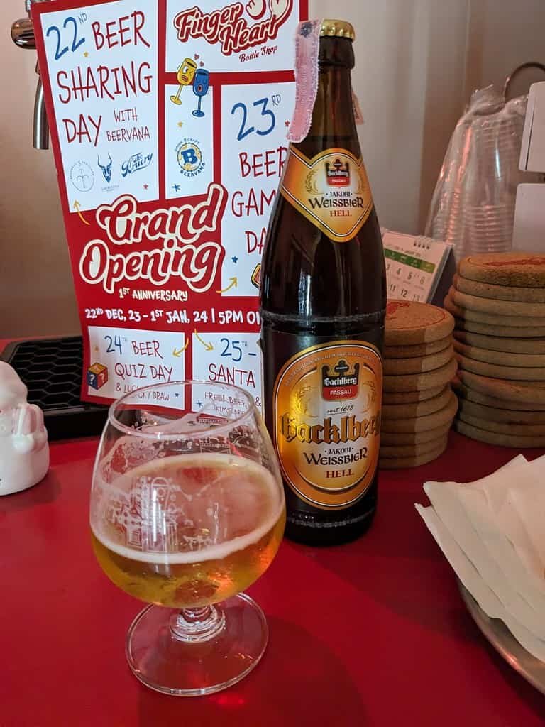 Finger Heart Grand Opening in Bangkok Thailand, beer in a glass and bottle.