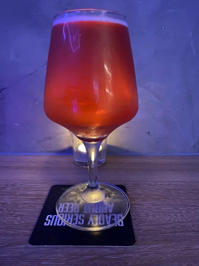 Glass of Channimit Cider by De Ploy Brewery in Thailand. Picture taken at 39 Craft Coffee in Bangkok Thailand.