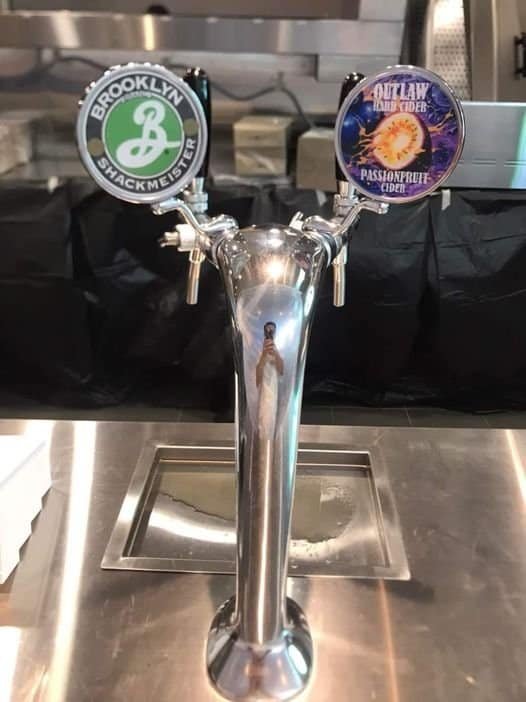 Outlaw Brewing cider on tap at Shake Shack in Bangkok Thailand; next to the Brooklyn Brewery Shackmeister Beer taps