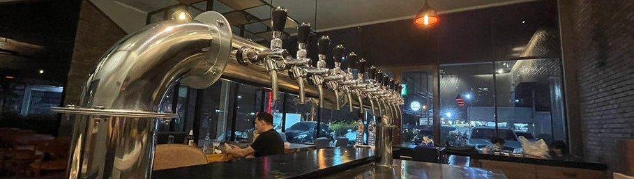 shiny beer serving equipment at Third Pint Brewpub - Craft Beer 'n Coffee.
Bangkok Thailand.