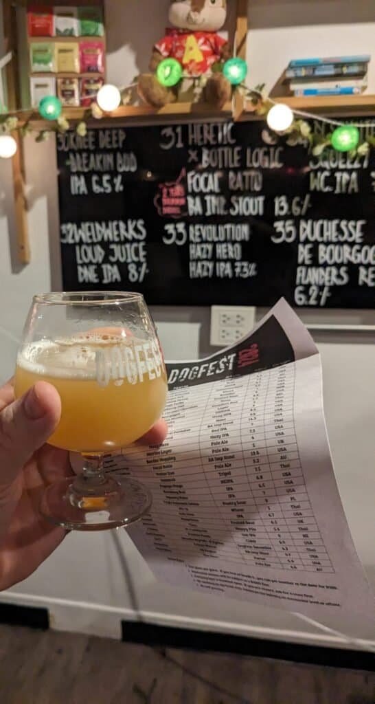 Small goblet of beer in DOGFEST branded glass at Hair of the Dog craft beer bar in Bangkok Thailand.