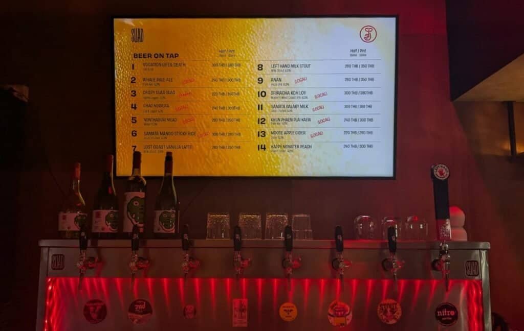 Serving a beer at SUAD bar, a beer oasis in Bangkok