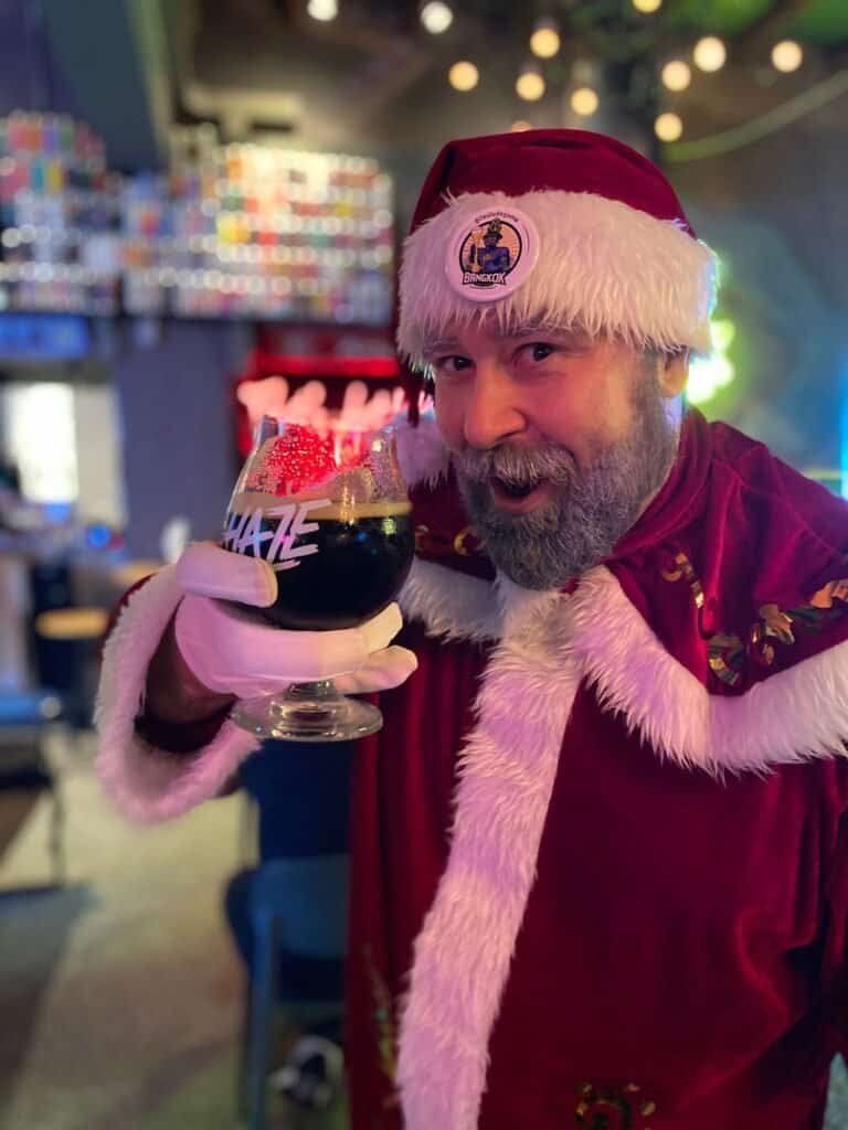 Santa drinks beer at Haze bar in Bangkok Thailand.
