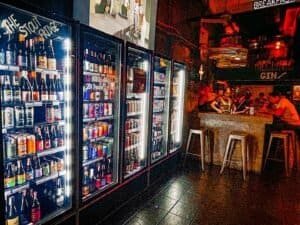 Hair of the Dog with the long row of craft beer fridges and bar, located in Bangkok Thailand